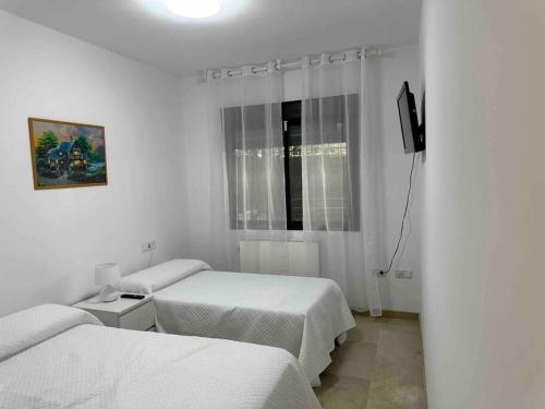 Ένα ή περισσότερα κρεβάτια σε δωμάτιο στο Alojamiento Los Cipreses