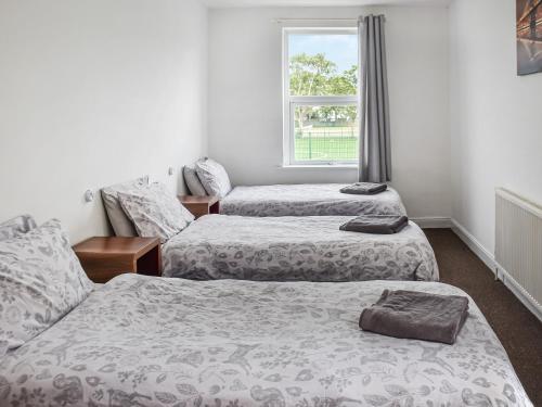 Postel nebo postele na pokoji v ubytování Seaside