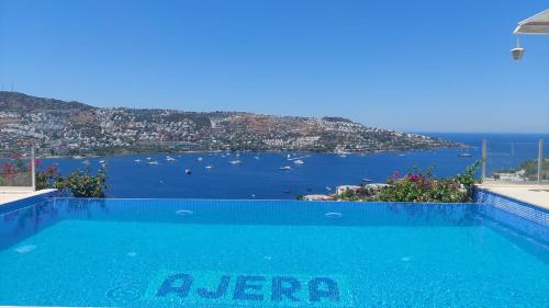 a swimming pool with a view of the ocean at MAGNIFICENT VIEW with Private Pool & Piano, 3 Bedroom Villa, MIN 4 nigths in Gundogan