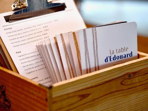 a wooden box filled with books on a table at ibis Styles Nantes Reze Aéroport in Rezé