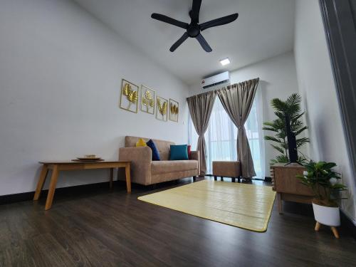 a living room with a couch and a table at Bunga Rampai Homestay, Vista Bangi in Bangi