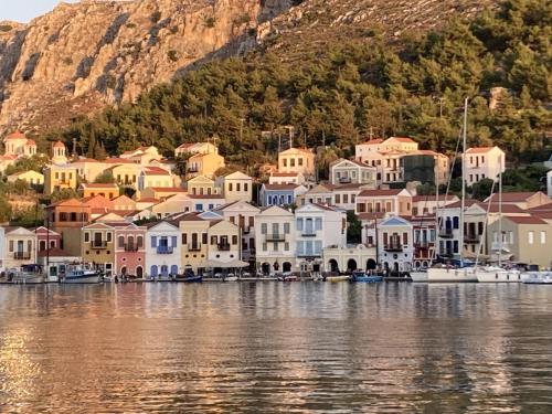 a group of houses on the shore of a body of water at Chroma Kastellorizo in Meyisti