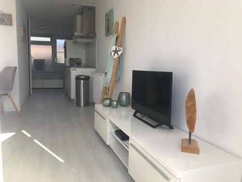 TV a/nebo společenská místnost v ubytování Casa Belle Dune