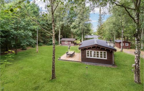 a small cabin in the middle of a yard at Holiday Home Jelsevej Ix in Højslev