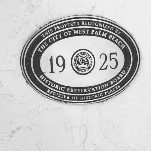 a sign on a wall that says the gift of west palm beach at Grandview Gardens in West Palm Beach
