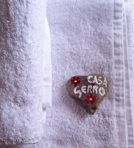 a heart shaped cookie with the words casa serena written on it at Appartamento panoramico Casa Gerro in Averara