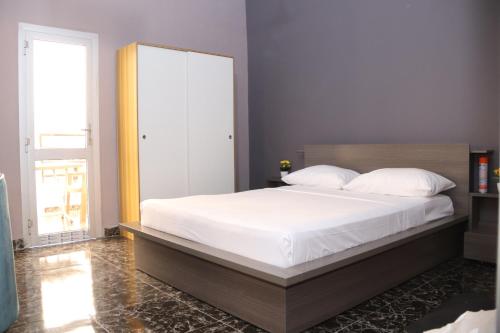Voodi või voodid majutusasutuse Appartement Bamako ACI 2000 toas