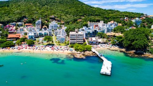 an aerial view of a resort on a beach at Pousada Vila do Navegante in Bombinhas