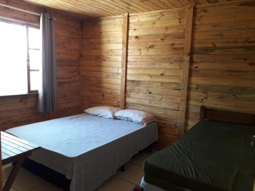 Ένα ή περισσότερα κρεβάτια σε δωμάτιο στο Casa com Piscina Tv e Wi-fi, pertinho do Mar