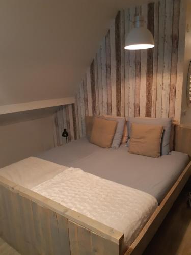 Postel nebo postele na pokoji v ubytování De Hooizolder