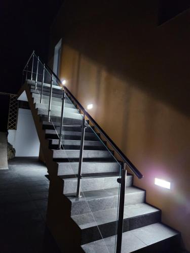 a set of stairs in a building with lights at Rosegarden View in Velas
