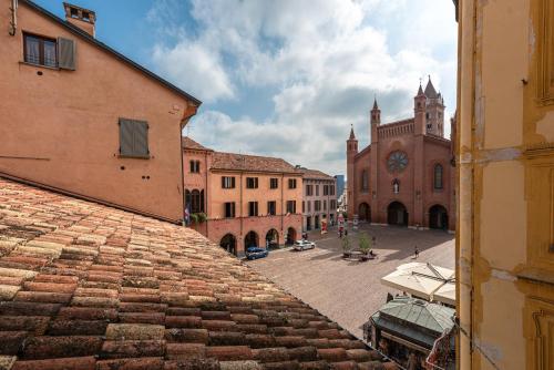 a view of a city street with a clock tower at Palazzo Ciravegna in Alba
