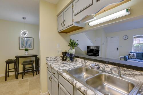 a kitchen with a sink and a counter at 4 Mi to Dtwn Pet-Friendly Abode in Tallahassee! in Tallahassee