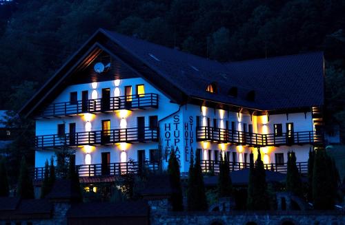 a house lit up at night with lights at Stupari in Shaian