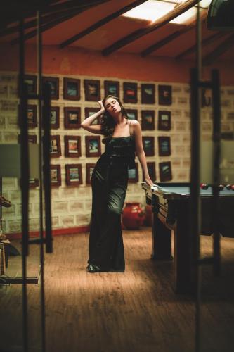 a woman in a black dress standing in a room at Hotel de Sal Luna Salada in Colchani