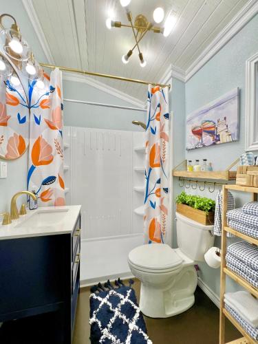 a bathroom with a toilet and a sink at SLEEPS SIX - Rent Entire WATERFRONT Cabin #2 in Etoile