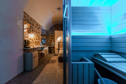 a room with blue walls and a blue ceiling at Anima Suite - Sauna - Jacuzzi e Cucina in Procida