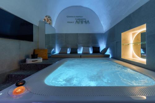 a large jacuzzi tub in a hotel room at Anima Suite - Sauna - Jacuzzi e Cucina in Procida