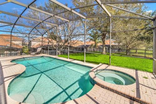 a large swimming pool with a pergola at WH7783TB-Windsor Hills- 10 guests - in Orlando