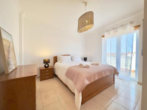 Ένα ή περισσότερα κρεβάτια σε δωμάτιο στο Ocean Penthouse Ferrel
