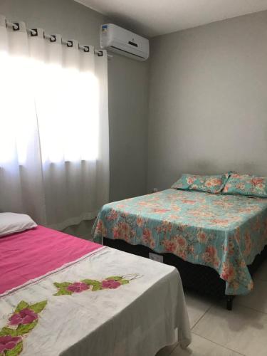 Een bed of bedden in een kamer bij Casa Vitória