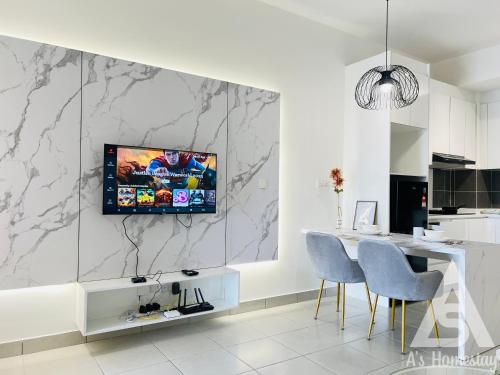 a kitchen with a table and a tv on a wall at Netizen Soho 2pax MRT Cheras Wi-Fi VsHome in Cheras