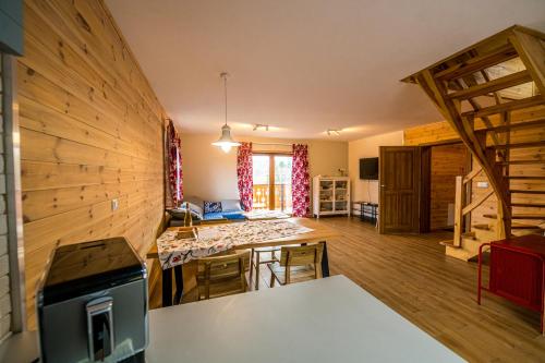 a large room with a kitchen and a living room at Kolorowe Karkonosze in Przesieka