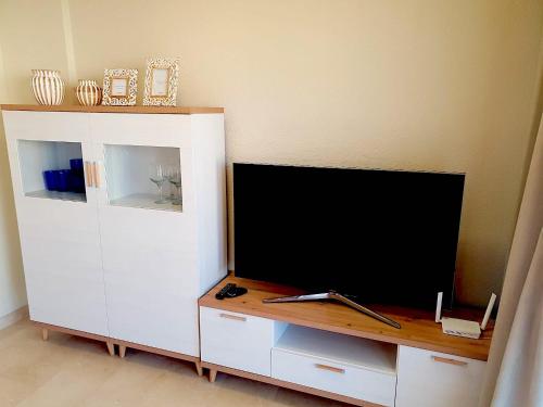 TV a/nebo společenská místnost v ubytování Apartamento Veramar