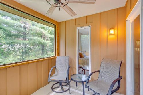 two chairs and a table in a room with a window at Charming Stockholm Abode in Walkable Location! in Stockholm