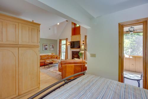 a bedroom with a bed and a living room at Charming Stockholm Abode in Walkable Location! in Stockholm