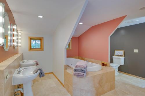 a bathroom with a sink and a bath tub at Charming Stockholm Abode in Walkable Location! in Stockholm