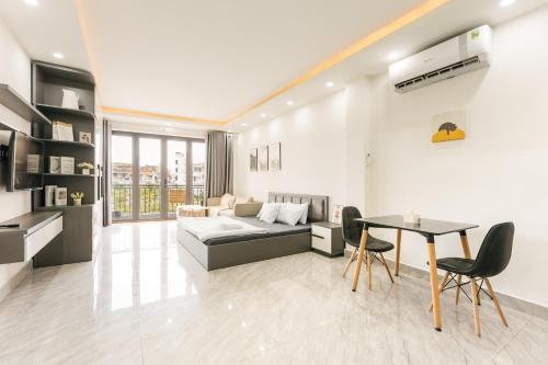a living room with a couch and a table at A Room Apartment River view in Haiphong Walking Str in Hai Phong
