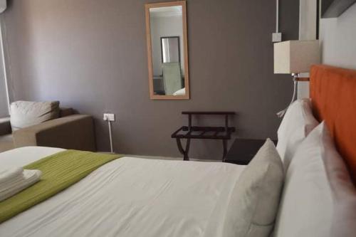 Ένα ή περισσότερα κρεβάτια σε δωμάτιο στο Ranks Guesthouse
