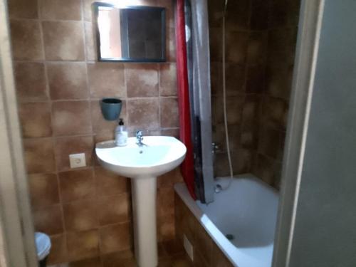 a bathroom with a sink and a toilet and a shower at Apartment El Solcito in Alicante