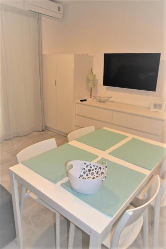 a white table with a bowl on top of it at Vila Snježana Tučepi in Tučepi