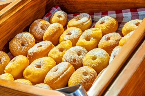 a bunch of donuts in a display case at Sonesta Hotel Bogotá in Bogotá