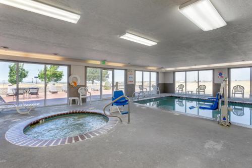 a swimming pool in a building with a swimming pool at Quality Inn & Suites Fillmore I-15 in Fillmore