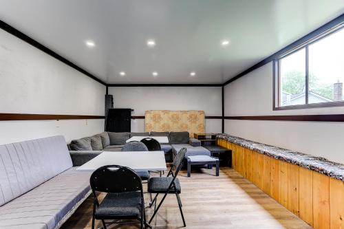 a room with a couch and chairs and a table at Stone Fountain Motel in Fenelon Falls