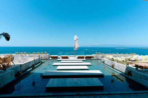 a swimming pool with a view of the ocean at Swissôtel Living Bodrum in Bodrum City