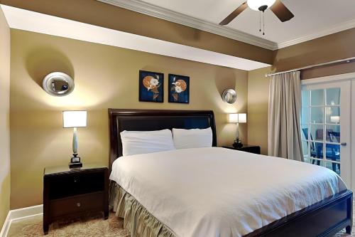 a bedroom with a large bed and a window at Phoenix West II #1407 in Orange Beach