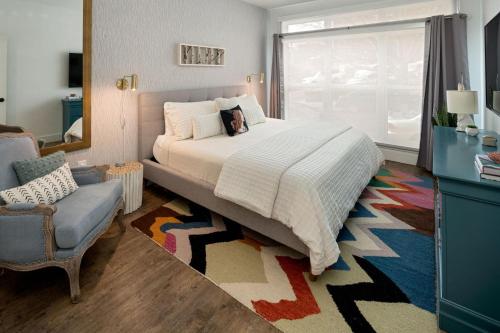 a bedroom with a bed with a dog laying on it at 55 South Market Condo 104 in Asheville