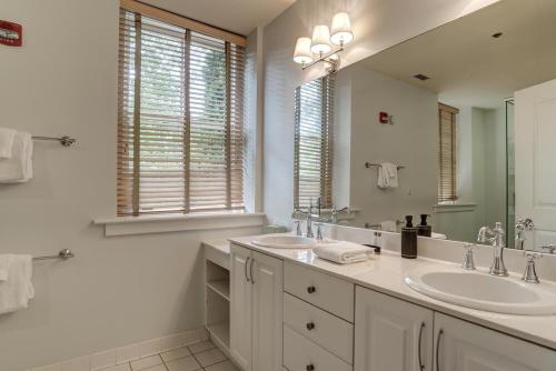 a bathroom with two sinks and a large mirror at 8 Village Lane 100 in Asheville