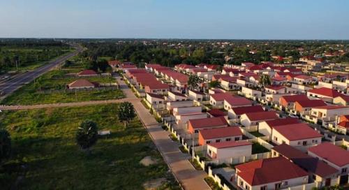 an aerial view of a village with red roofs at Rahims 3 Bed Bungalow - Dalaba in Jarbang