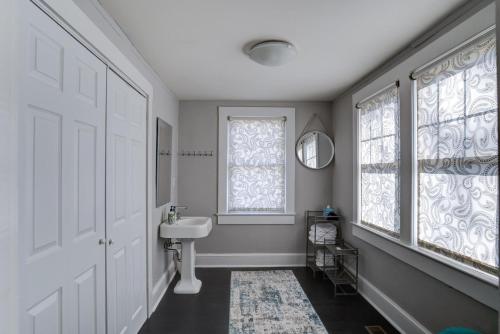 a bathroom with a sink and a window at 237 East Chestnut St in Asheville