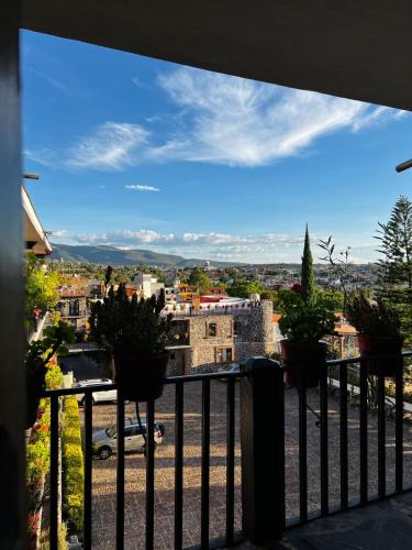 a view of a city from a balcony at Posada de las Monjas in San Miguel de Allende