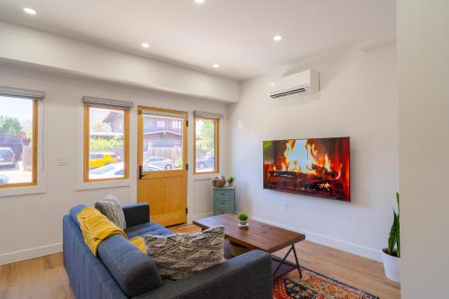 a living room with a couch and a table at Fern House South Park Craftsman in San Diego