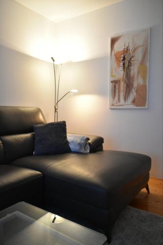 a living room with a couch and a lamp at 3 min. away in Koprivnica