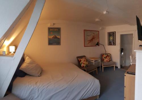 En eller flere senge i et værelse på Charming Cottage in a typical French Village