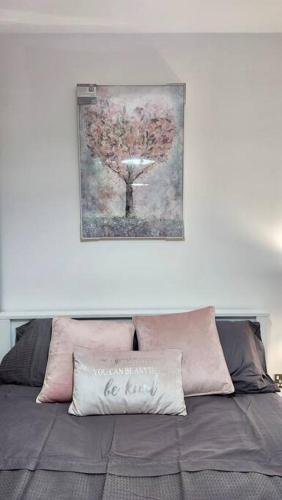 a picture of a tree above a bed at Stylish 2 Bed/Bath Apartment in Birmingham