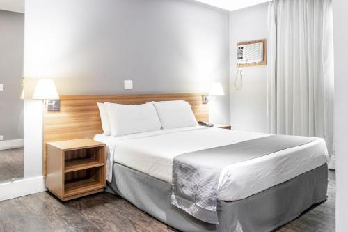 Ένα ή περισσότερα κρεβάτια σε δωμάτιο στο Braston Augusta Hotel by Castelo Itaipava